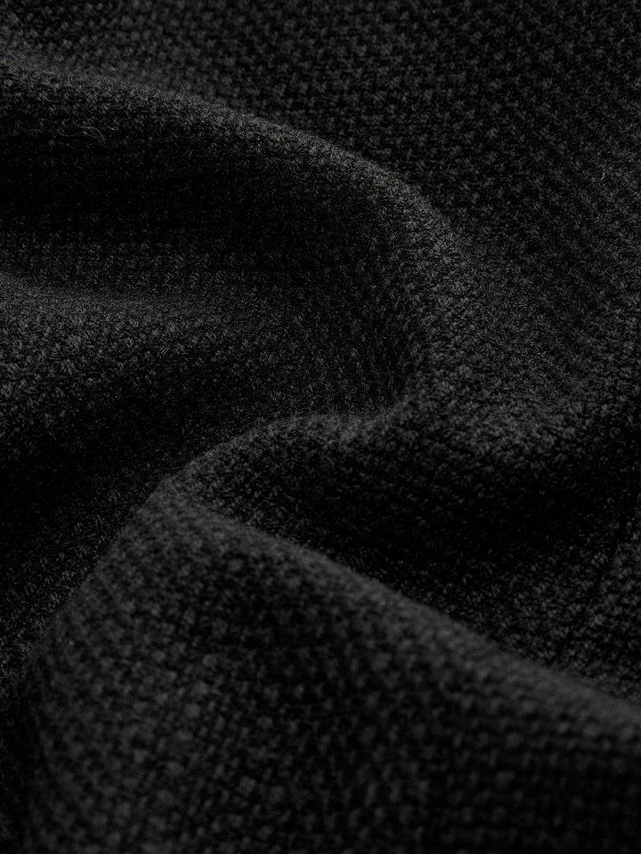 Kurze schwarze Jacke mit goldenen Knöpfen